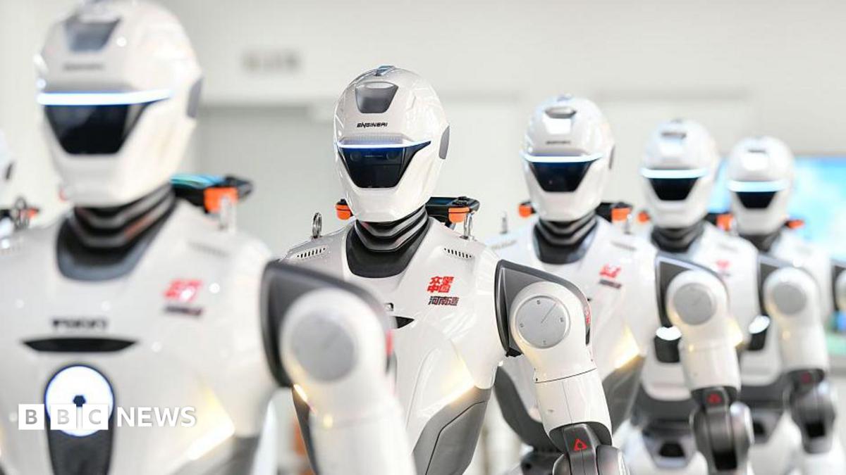 A row of humanoid robots are on display after rolling off the production line at a production facility in China