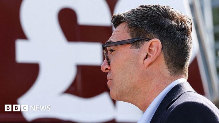 Side profile of Andy Burnham with a large £ sign behind him