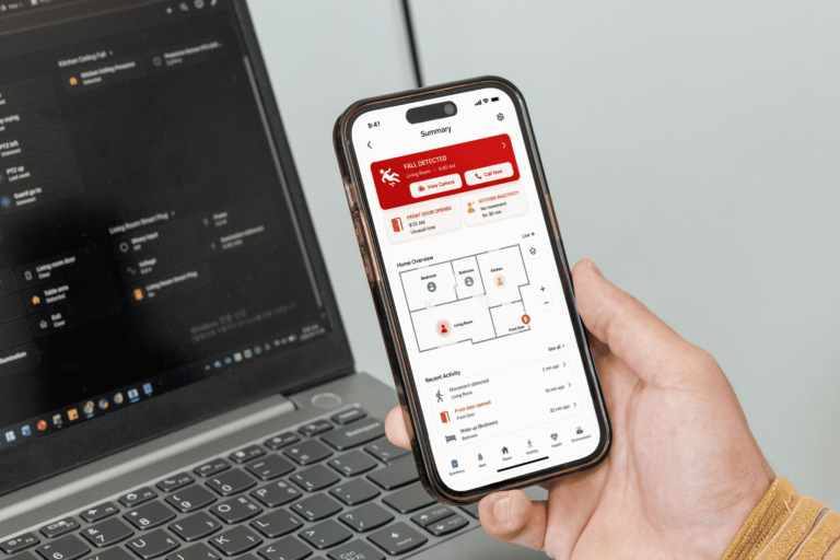 A hand holds a smartphone testing an app