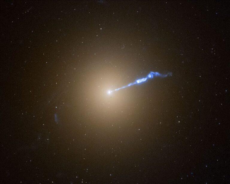 A bright light with a thin, blue-white jet spewing to the right