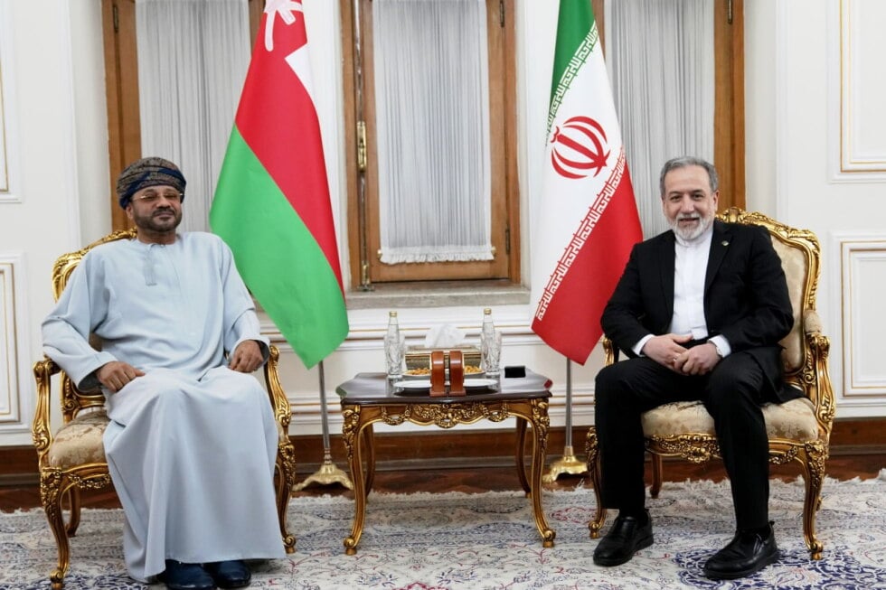 In this photo released by the Iranian Foreign Ministry, Foreign Minister Abbas Araghchi, right, meets his Omani counterpart