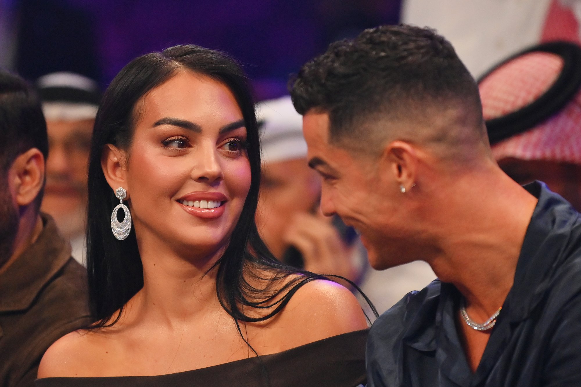 RIYADH, SAUDI ARABIA - OCTOBER 28: Cristiano Ronaldo and his wife Georgina Rodríguez speak ringside prior to the Heavyweight