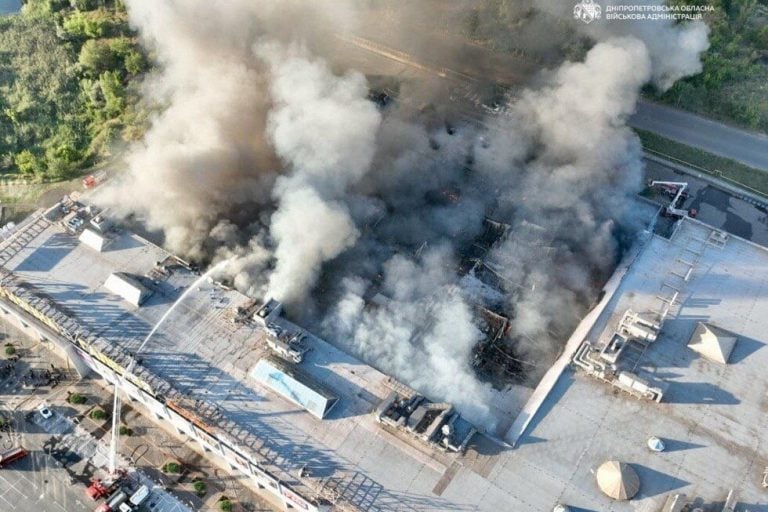 In this photo provided by the Ukrainian Military administration, firefighters work on a fire at a shopping mall following a