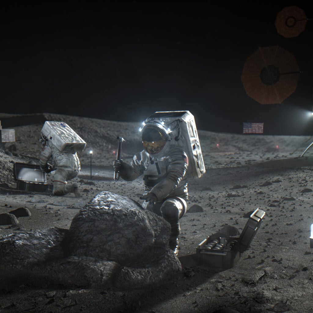 NASA concept illustration of two Artemis astronauts working on the lunar surface
