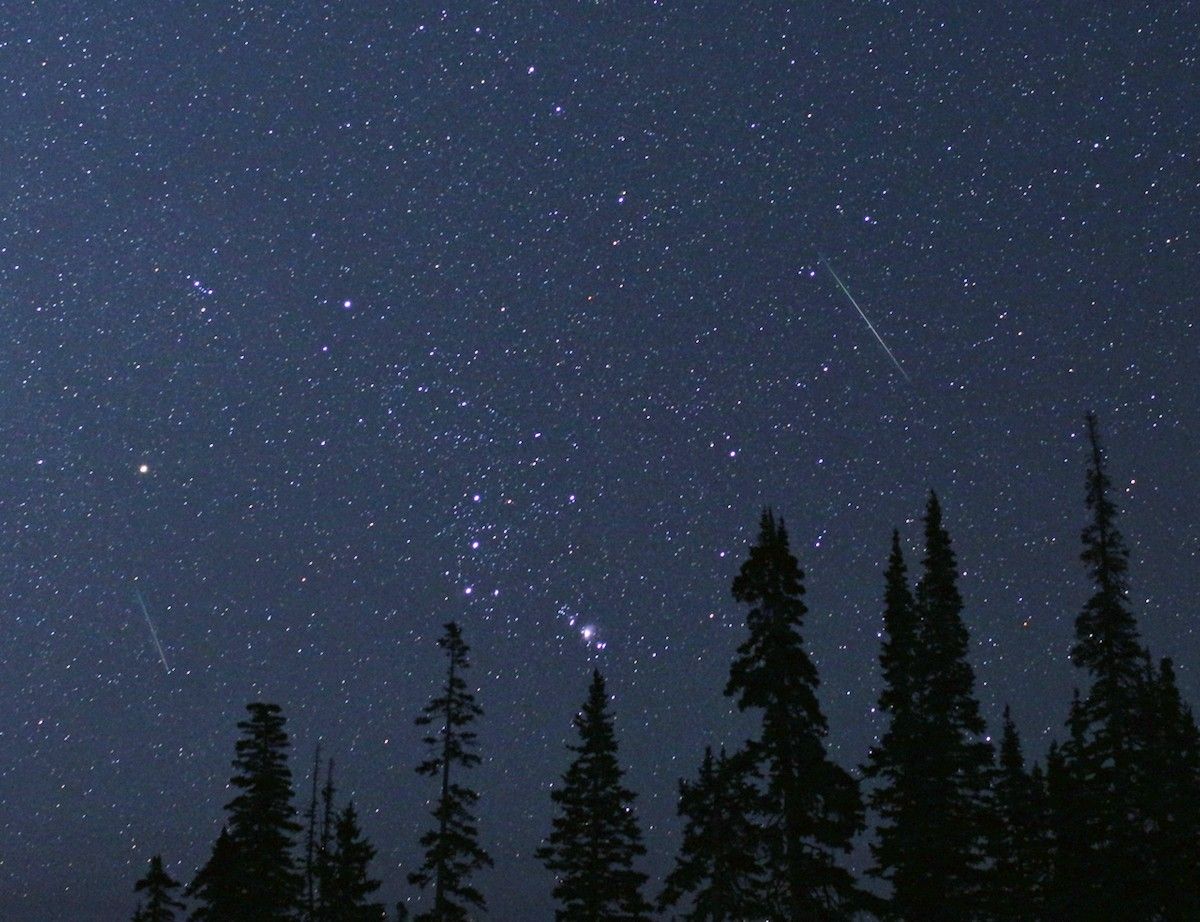 The constellation Orion is framed by two Perseid meteors on Aug. 12, 2018, in Cedar Breaks National Monument, Utah