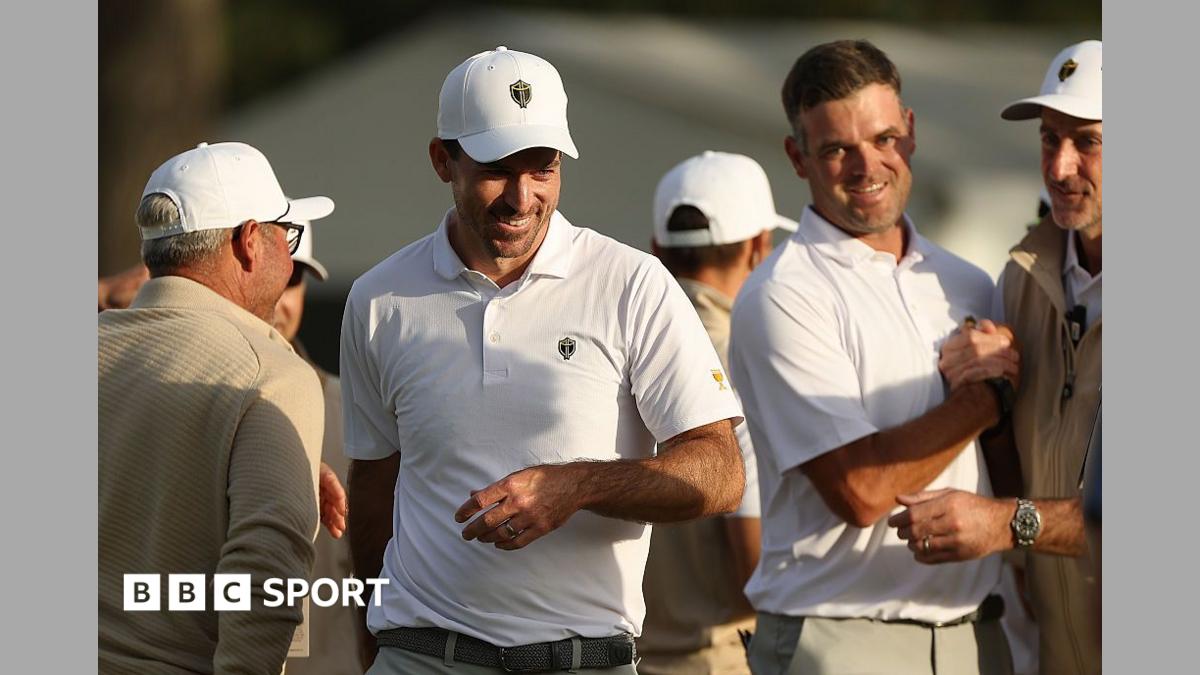 Canada's Corey Conners (centre) saved par on the 18th