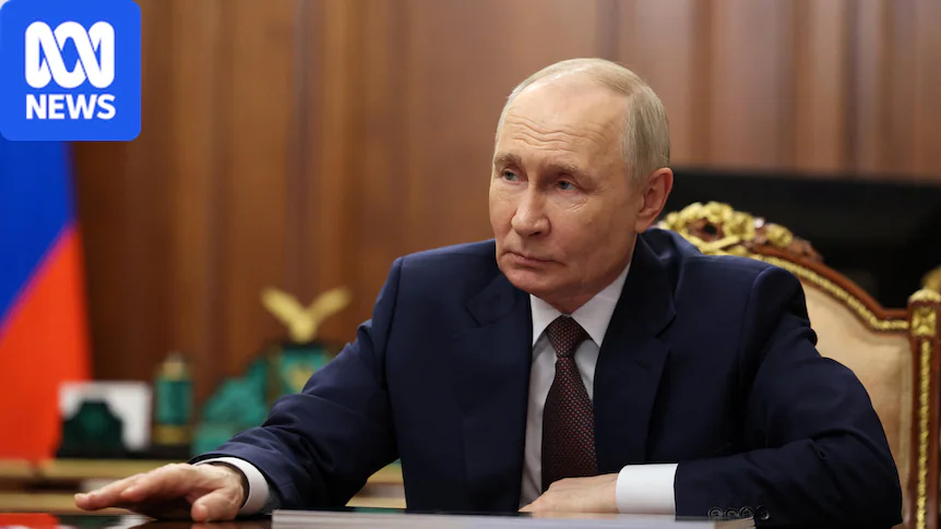 Russian President Vladimir Putin reaches his hand across a table