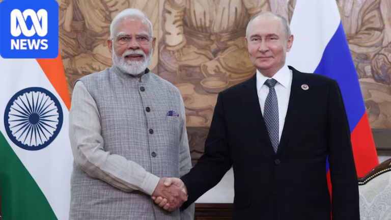 Russian President Vladimir Putin and Indian Prime Minister Narendra Modi shake hands during a meeting