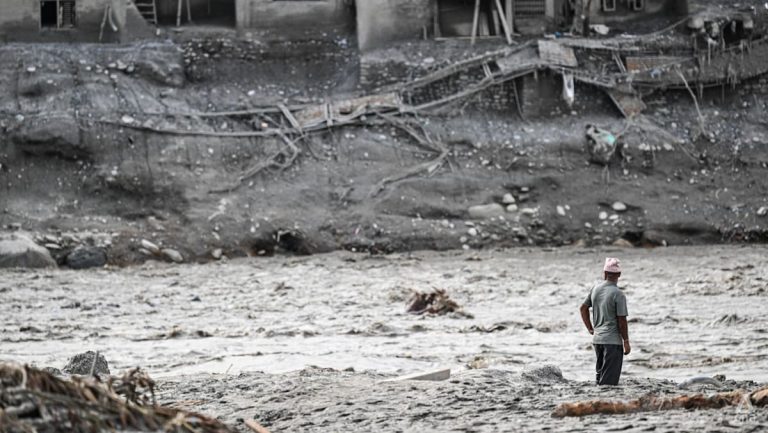 Nepal’s riverside communities cling to hope with loved ones missing after deadly flood