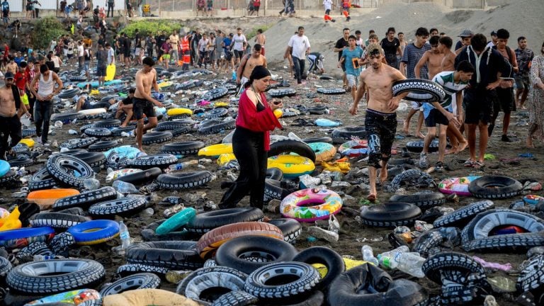 Tens of thousands crossed using rubber rings Pic: Europa Press/AP