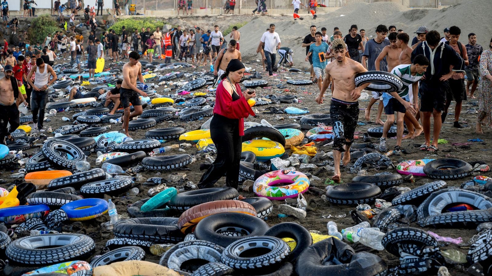 Tens of thousands crossed using rubber rings Pic: Europa Press/AP