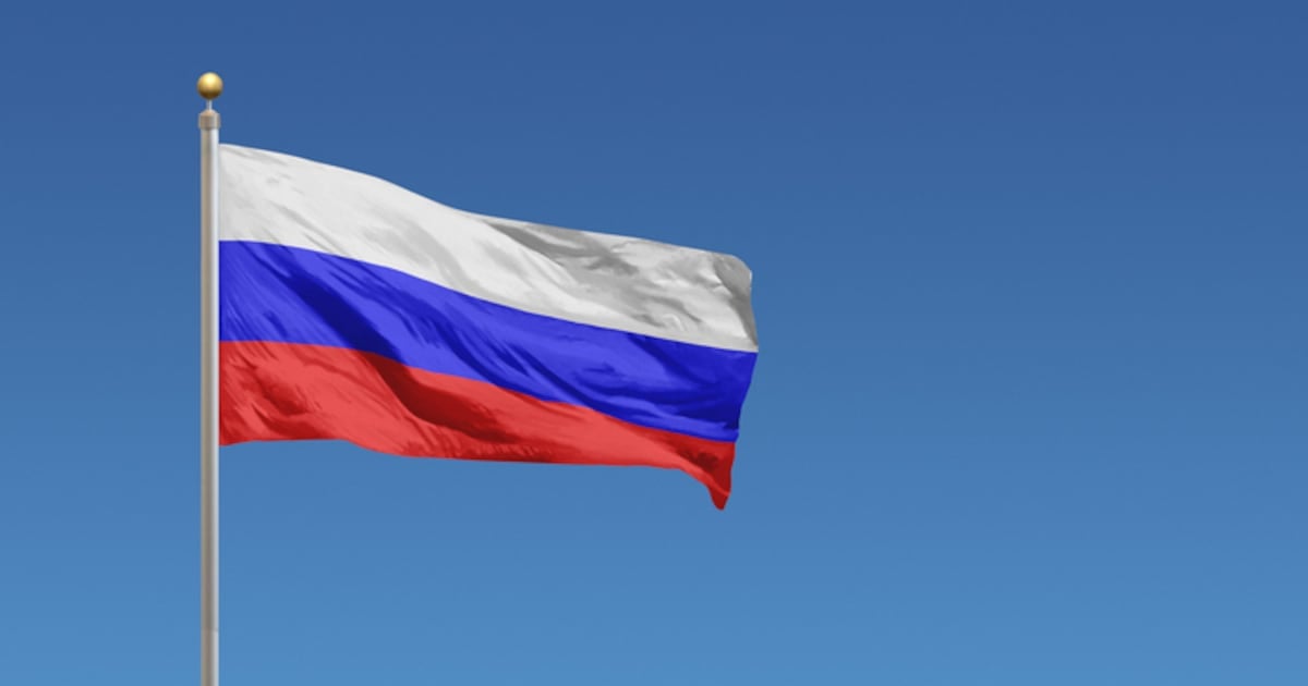 Flag of Russia in front of a clear blue sky (Photo courtesy iStock/Derek Brumby)